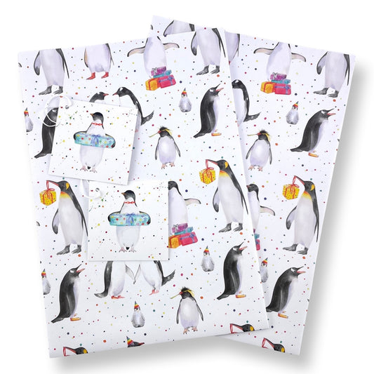 Penguin party recycled and recyclable gift wrap with matching tags by Ceinwen  Campbell