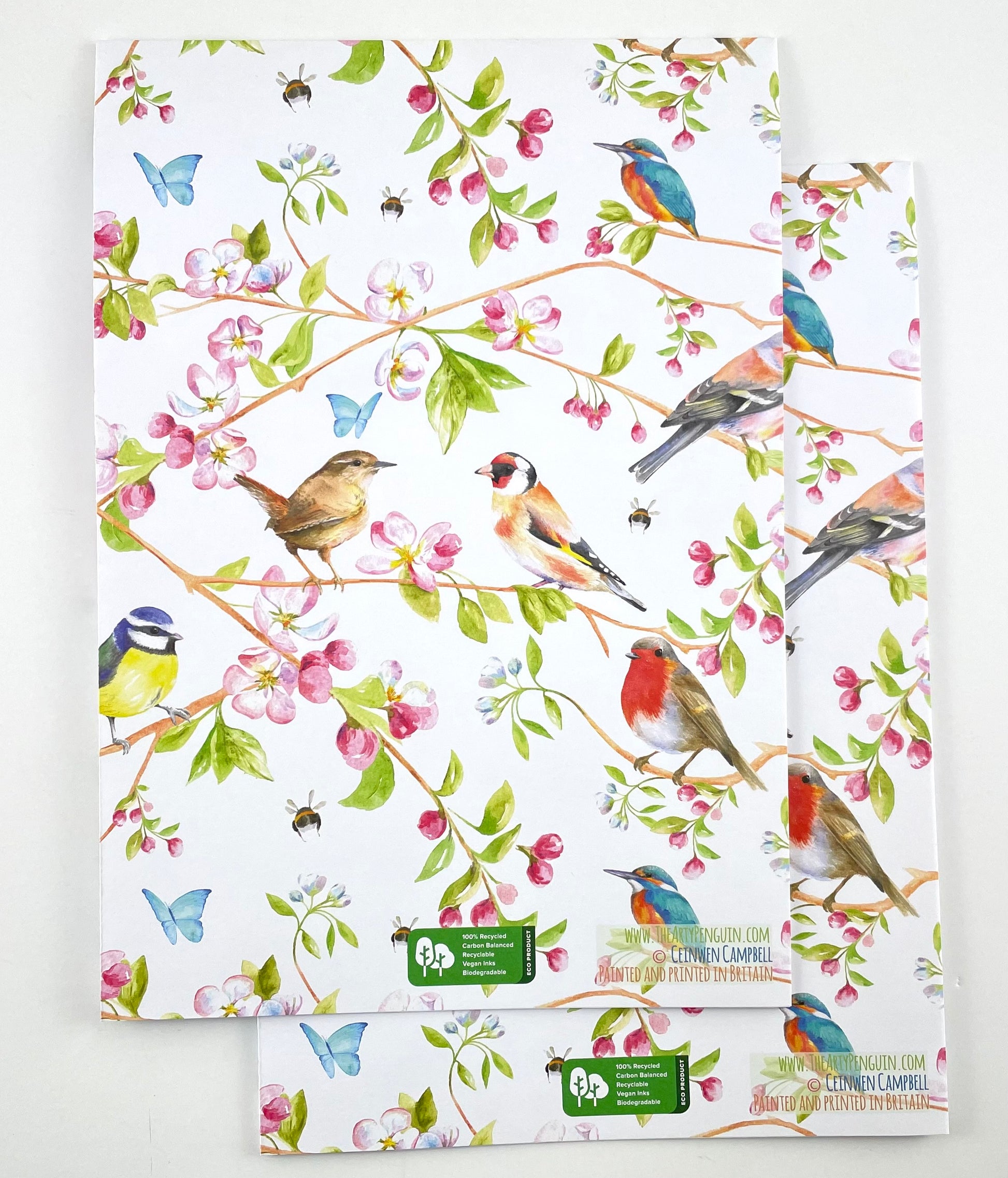 Garden birds recycled and recyclable quality gift wrapping  by Ceinwen Campbell - robin, wren , blue tit, cherry blossom folded . Printed with vegetable based inks iin Britain