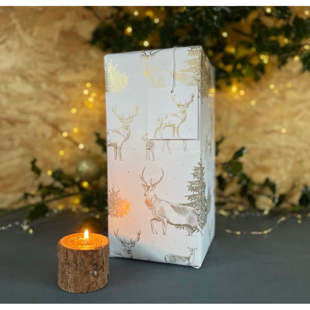 gold metallic recyclable paper made in Britain. Line drawings of stags, deer fir trees for a Christmas feel by Ceinwen Campbell